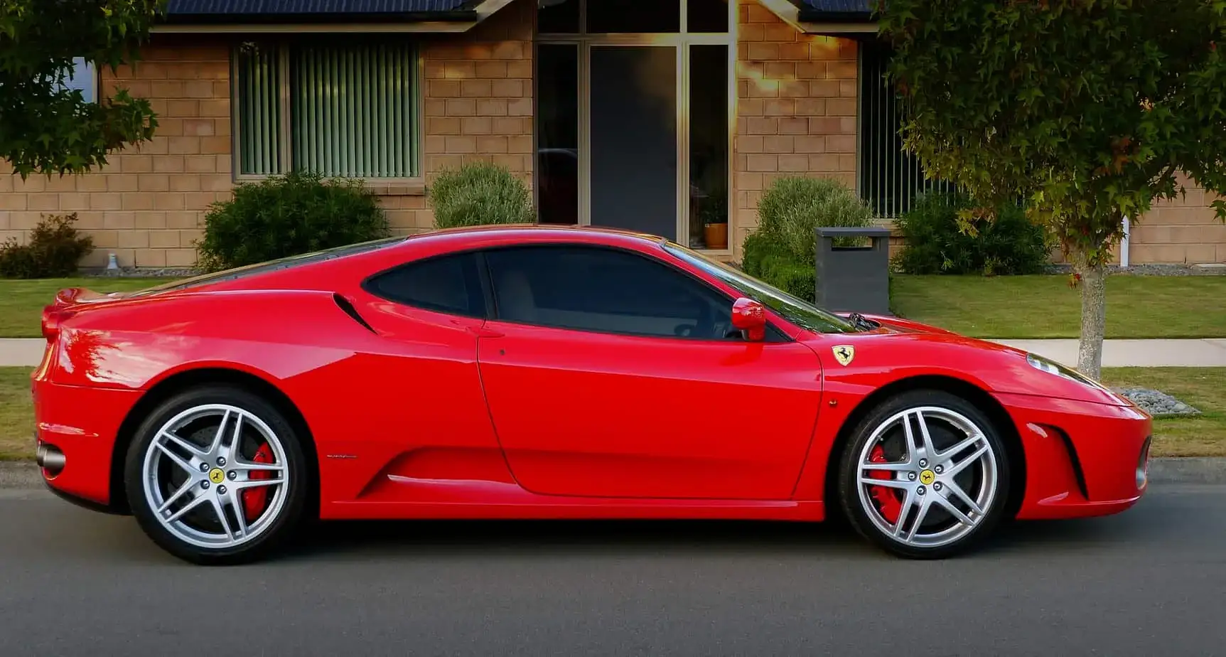 Kitchener exotic car on flatbed soft-strap transport