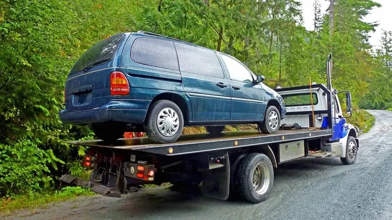 Kitchener flatbed towing a cargo van
